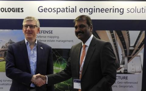 Ordnance Survey International and IIC Technologies signing an MoU