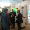 Mr. Steve Sawdon with visitors at the IIC Technologies stand, in IHO assembly, Monaco